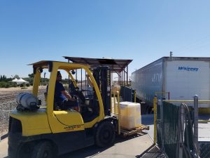 Truck at the loading dock with the forklift